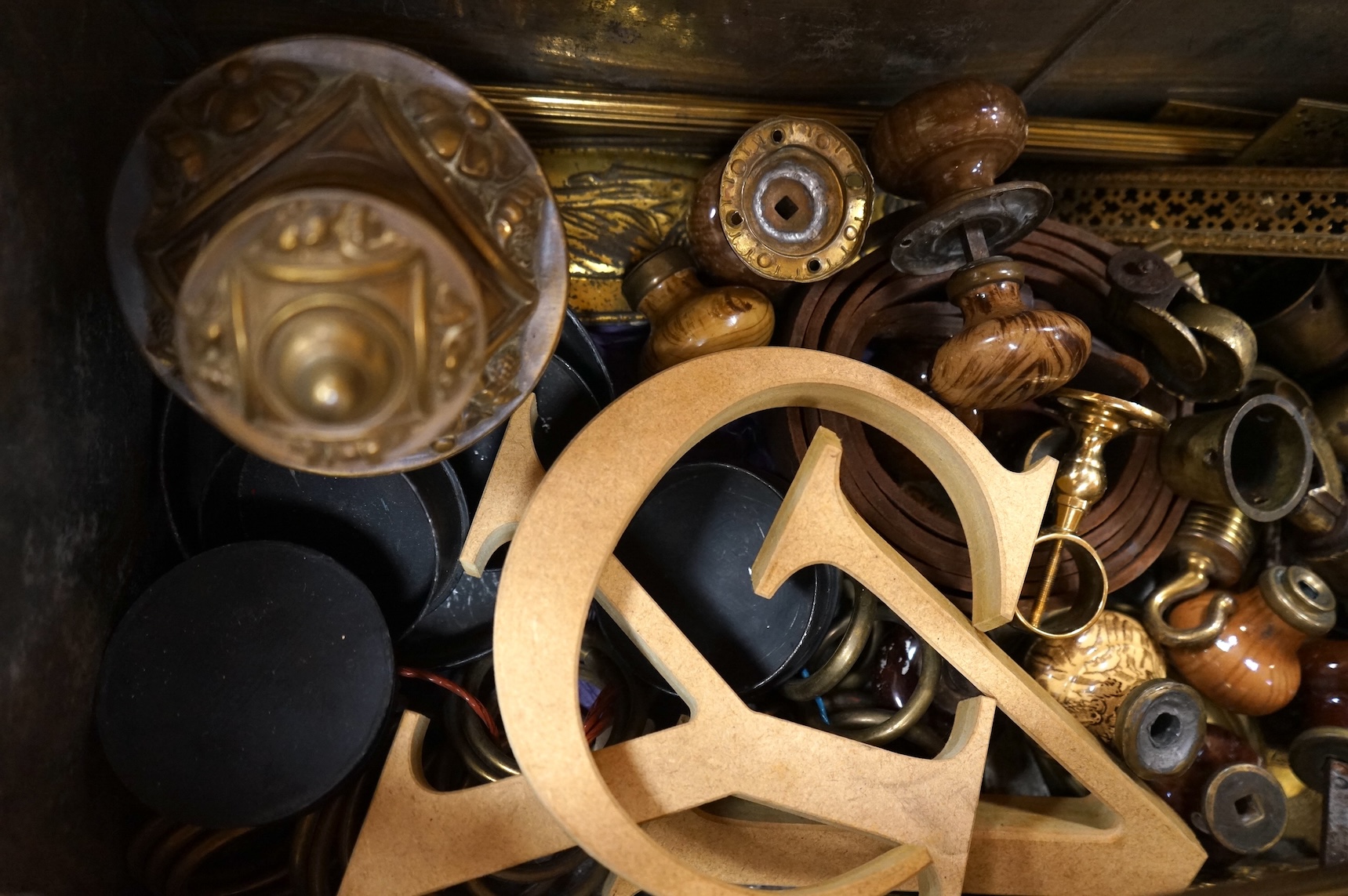An Anglepoise lamp and metal door furniture and fittings in a tin trunk